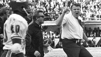 FILE - In this Dec. 12, 1970, file photo, Oakland Raiders coach John Madden, right, does a sort of jig as he waves his finger and shouts in protest at a referee's call in the third quarter of an NFL football game against the Kansas City Chiefs, in Oakland, Calif. (AP Photo/File)